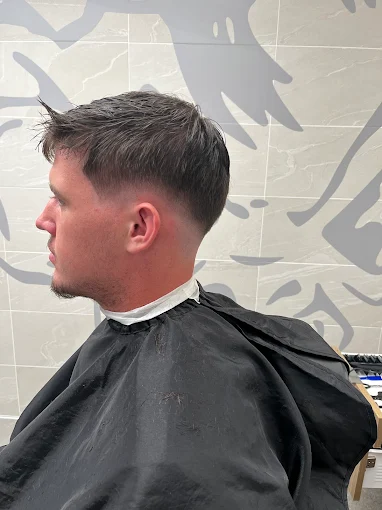 Short fade with a textured top, side view