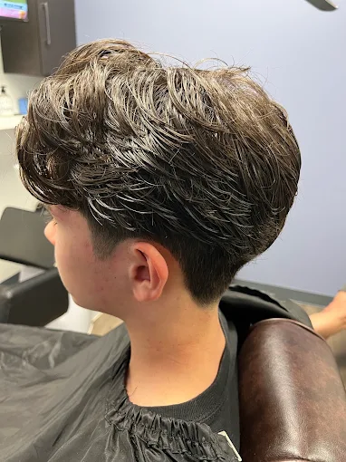 Textured, wavy haircut seen from the side