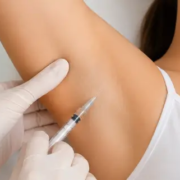 Close-up of a patient receiving underarm Botox injections for excessive sweating in Oahu, Hawaii at Hawaii Facial Plastic Surgery.