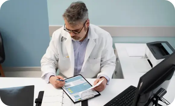 Clinic Director reviewing a patient’s consultation request, representing a personalized and pressure-free first step in care.