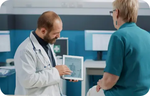 Doctor analyzing inflammation, joint health, and metabolic factors to create a custom regenerative therapy plan.