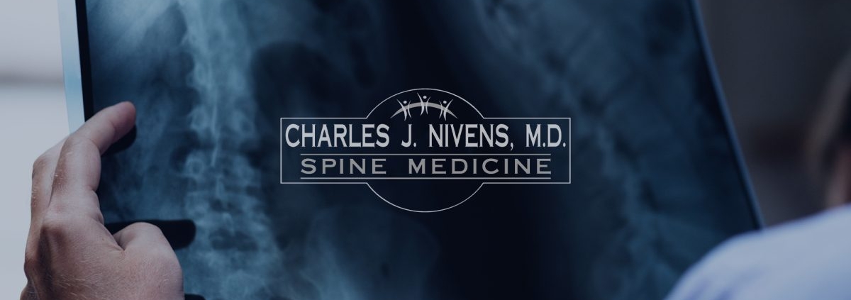 Patient discussing spine pain concerns and treatment options with specialist